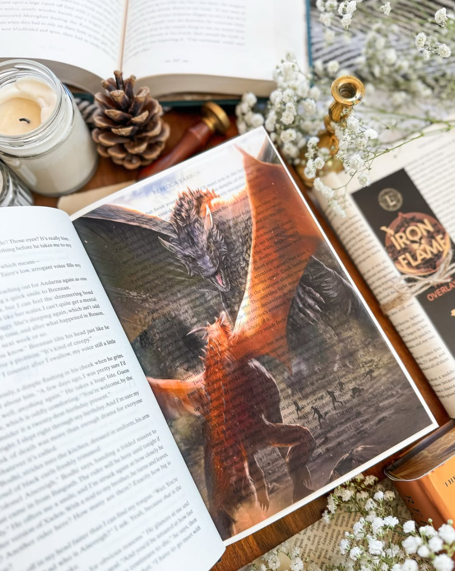 Semi-translucent acid-free vellum overlays highlighting an Iron Flame scene